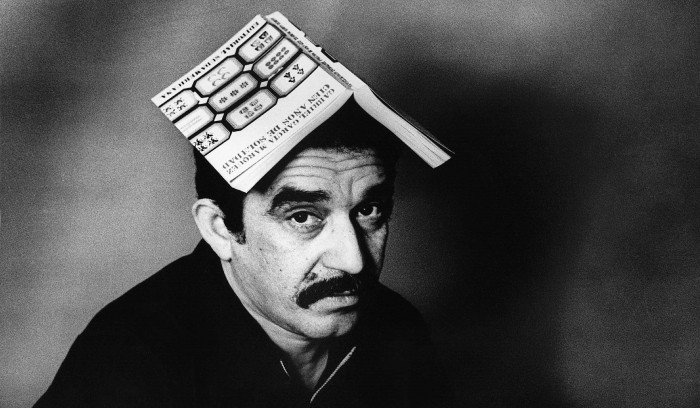 Gabriel Garcia Marquez with Book on Head