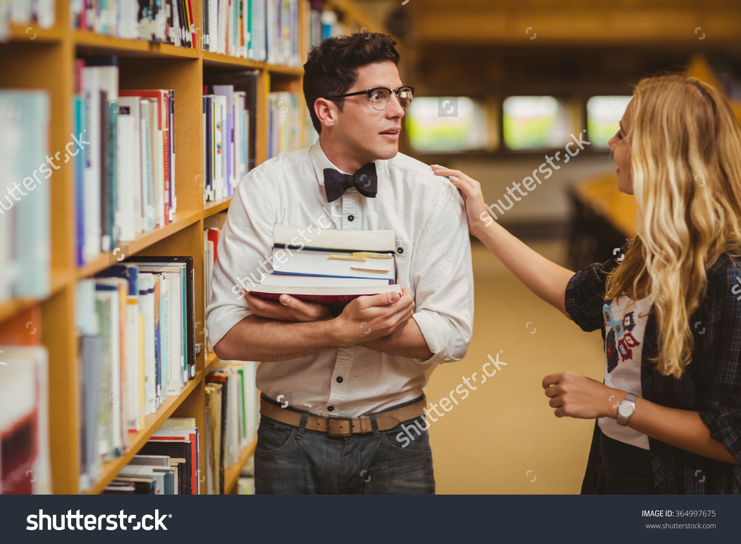 stock-photo-embarrassed-nerd-meeting-up-a-girl-in-library-364997675