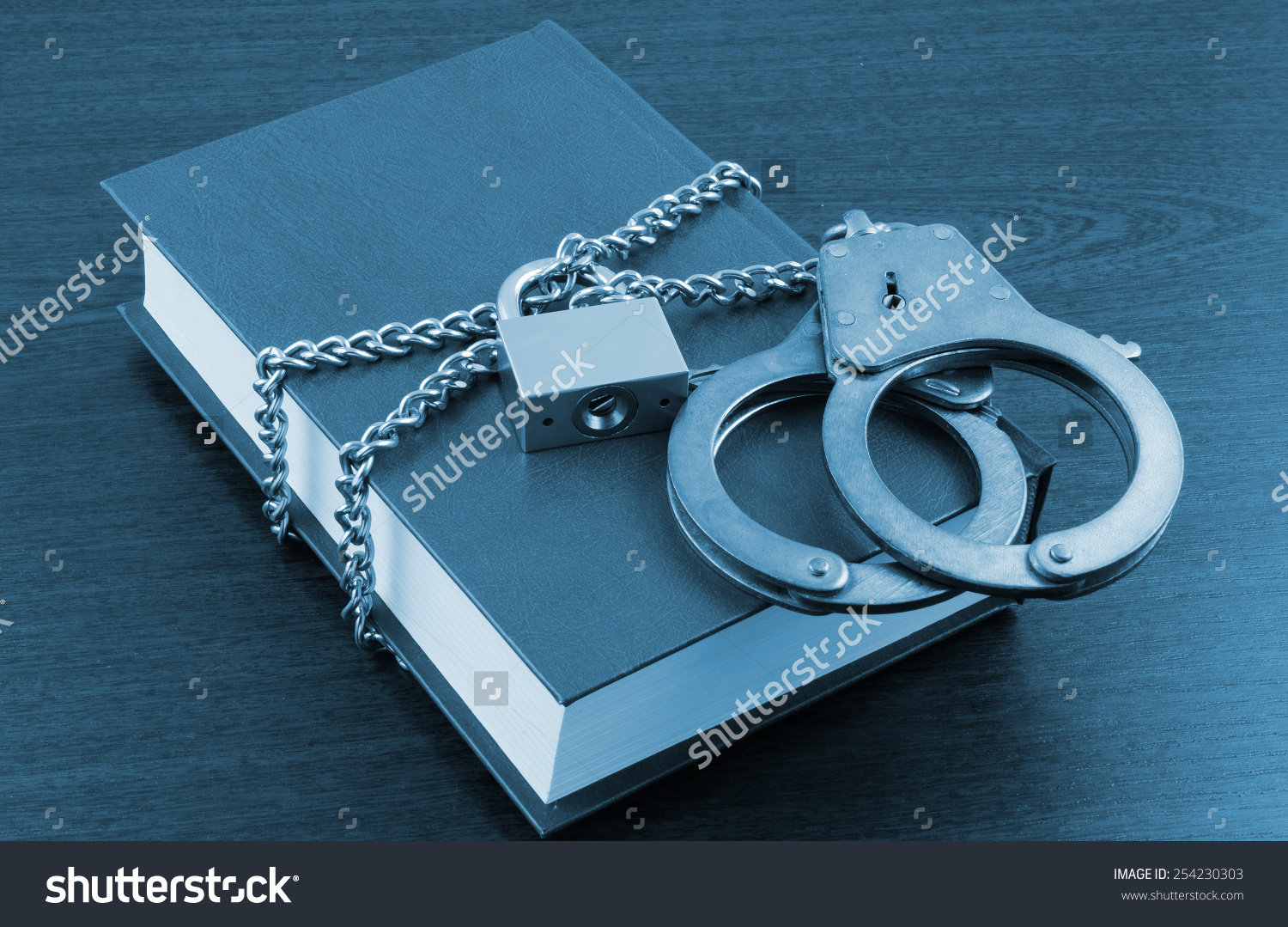 stock-photo-information-security-concept-handcuffs-book-with-chain-and-padlock-254230303