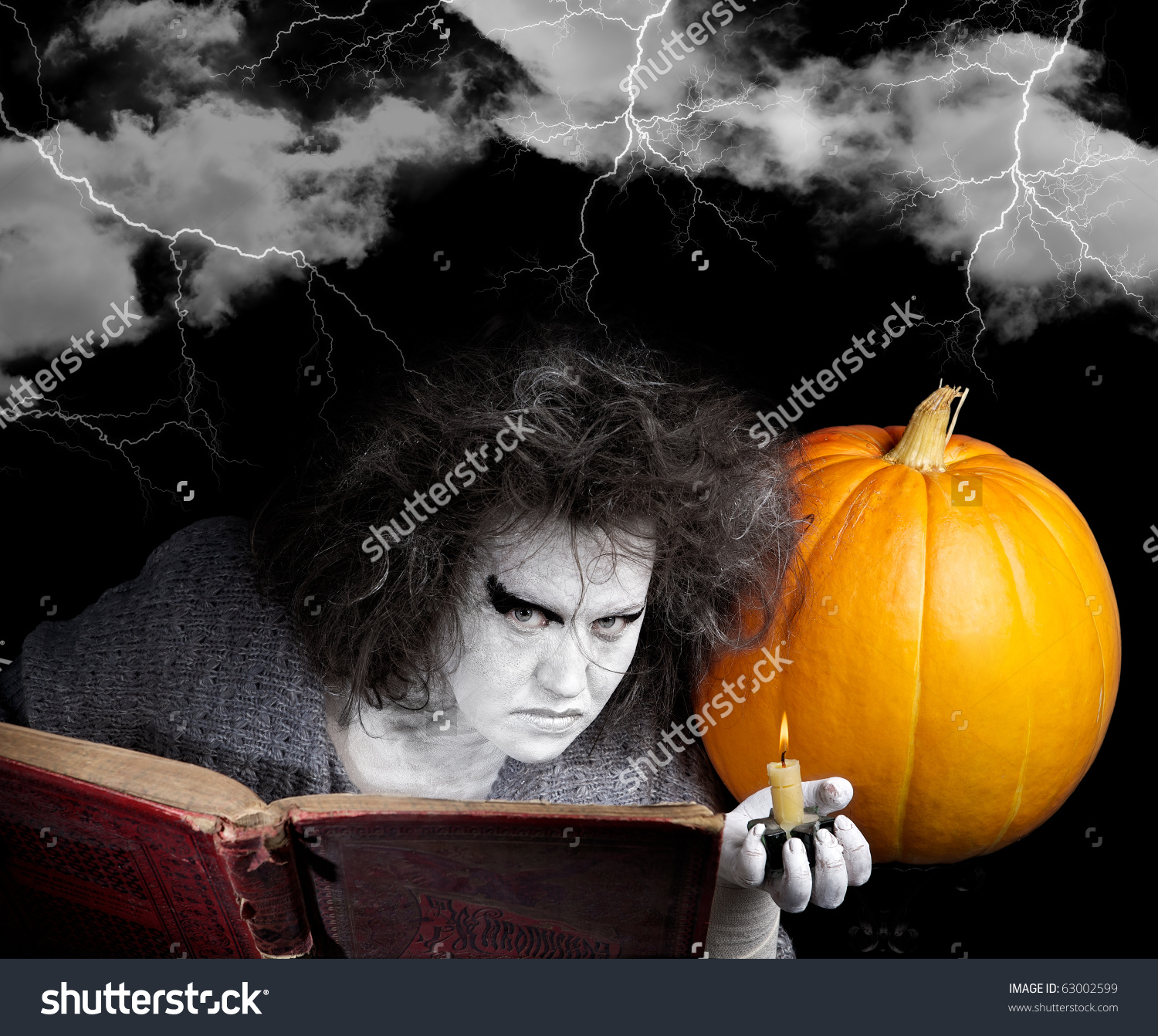 stock-photo-witch-with-a-magic-book-and-pumpkin-halloween-theme-63002599