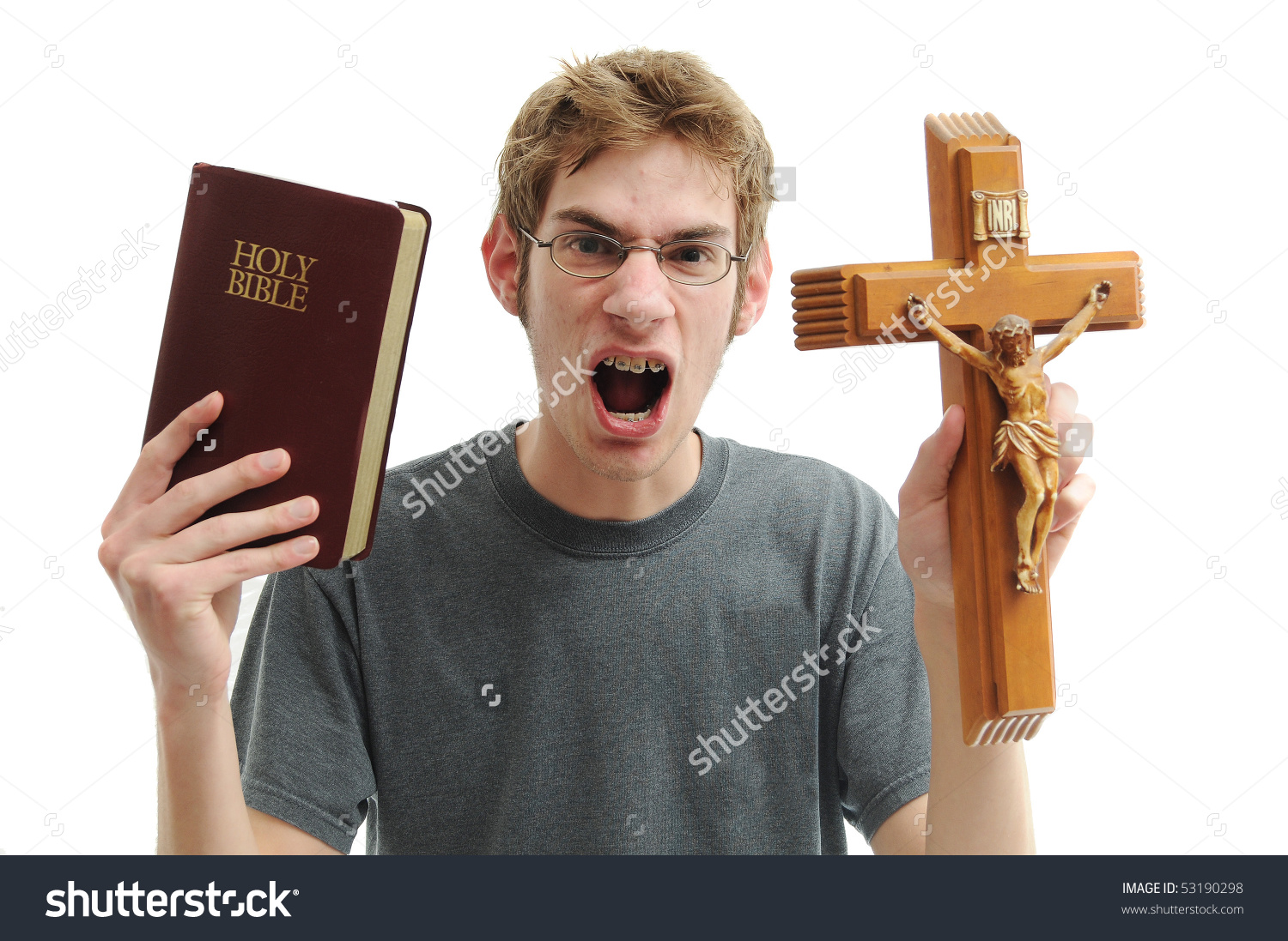 stock-photo-young-man-holds-up-a-wooden-crucifix-cross-and-a-red-leather-bible-while-yelling-in-anger-isolated-53190298